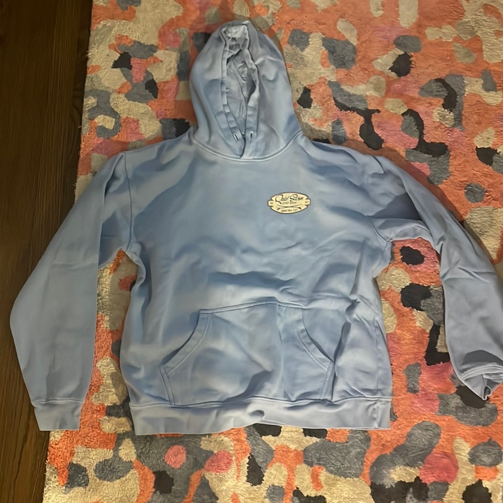 selling a size large light blue sweatshirt